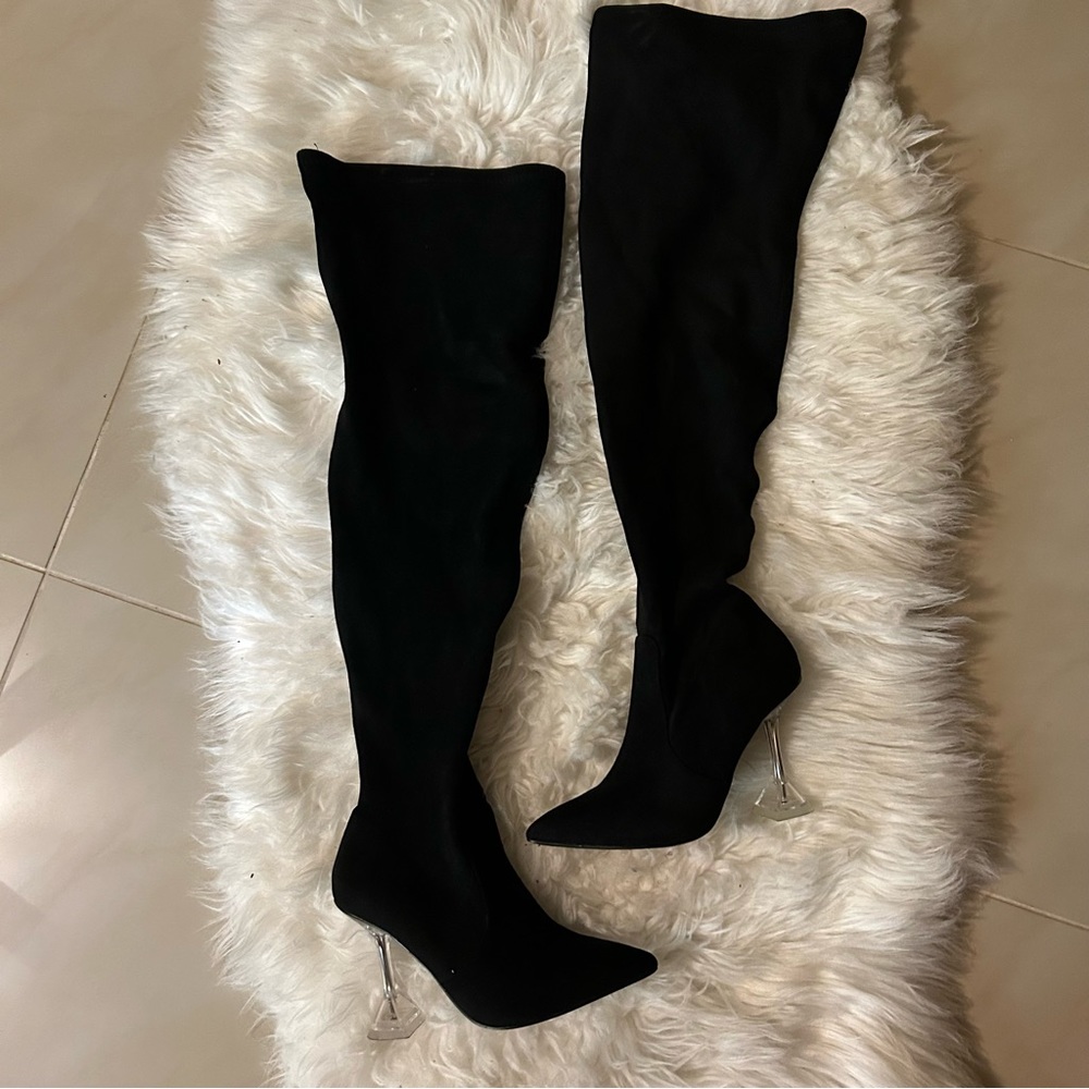 Black high knee boots with clear heels